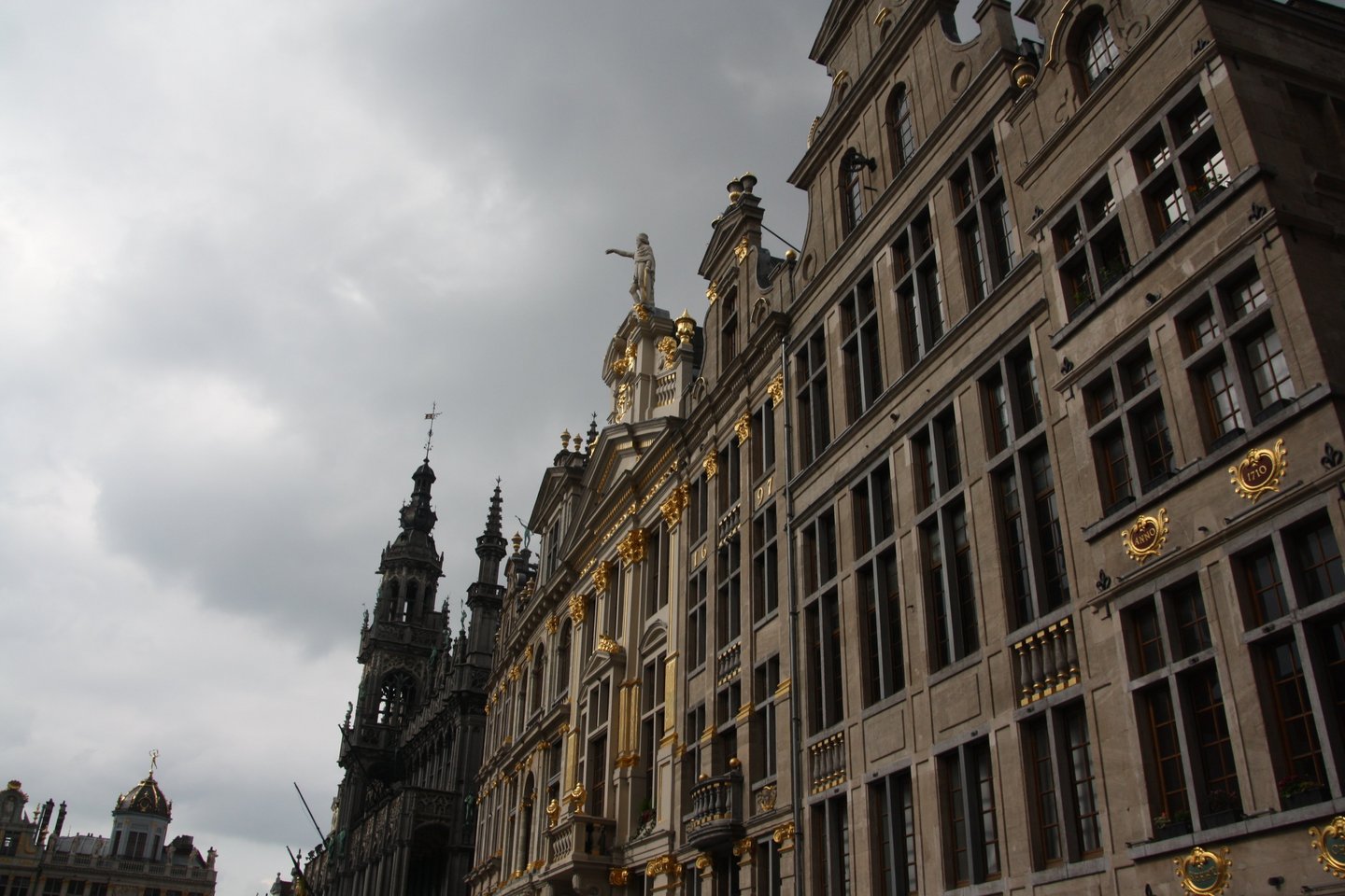 Building at the Grand Place with golden ornamentation on the outside.
