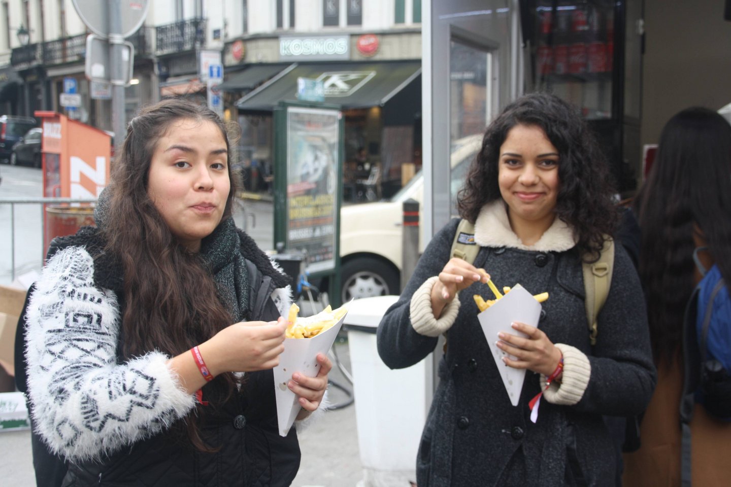 Two students about to eat belgian fries