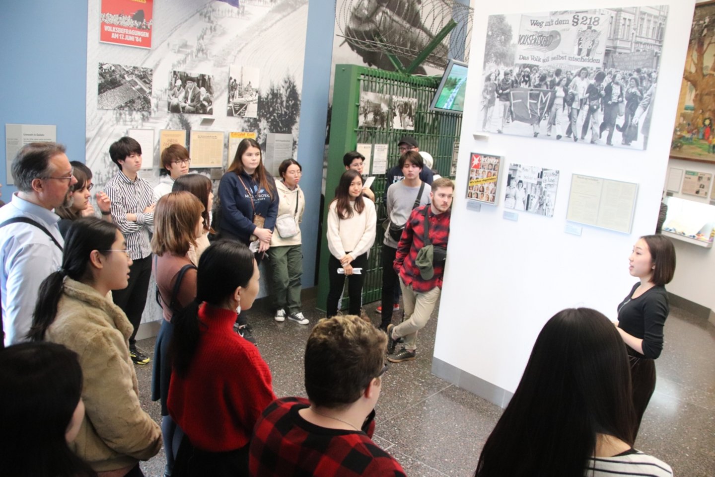 Group of students listening to the guide in the Haus der Geschichte.