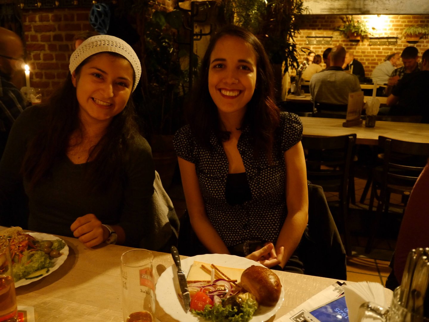 Two Students at the Hellers Brauhaus. They have food in front of them