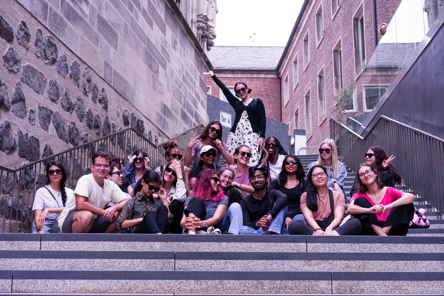 group picture of the CSS onsite participants on the stairs behind the Cologne City Hall