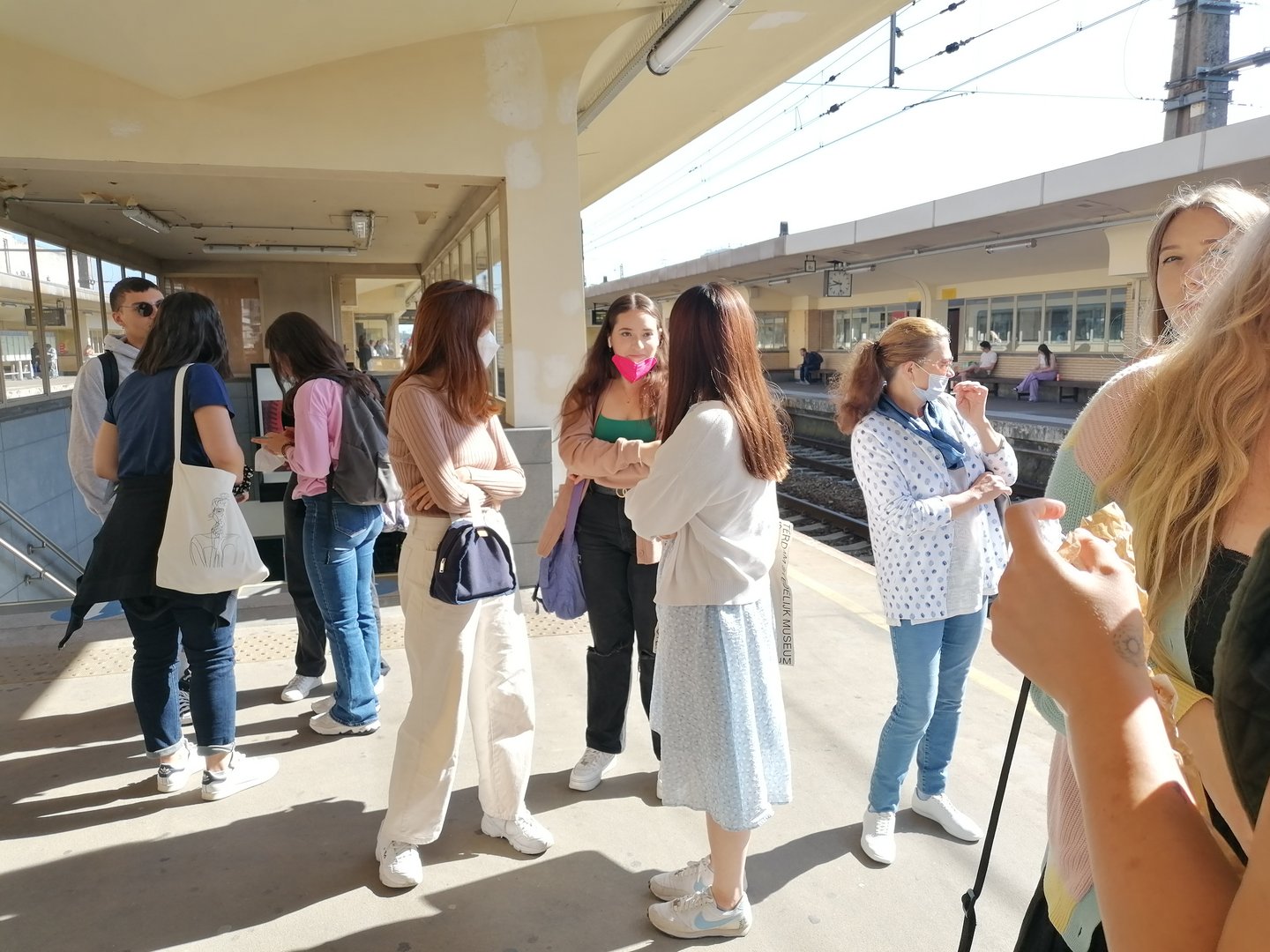 Students at platform waiting for the train