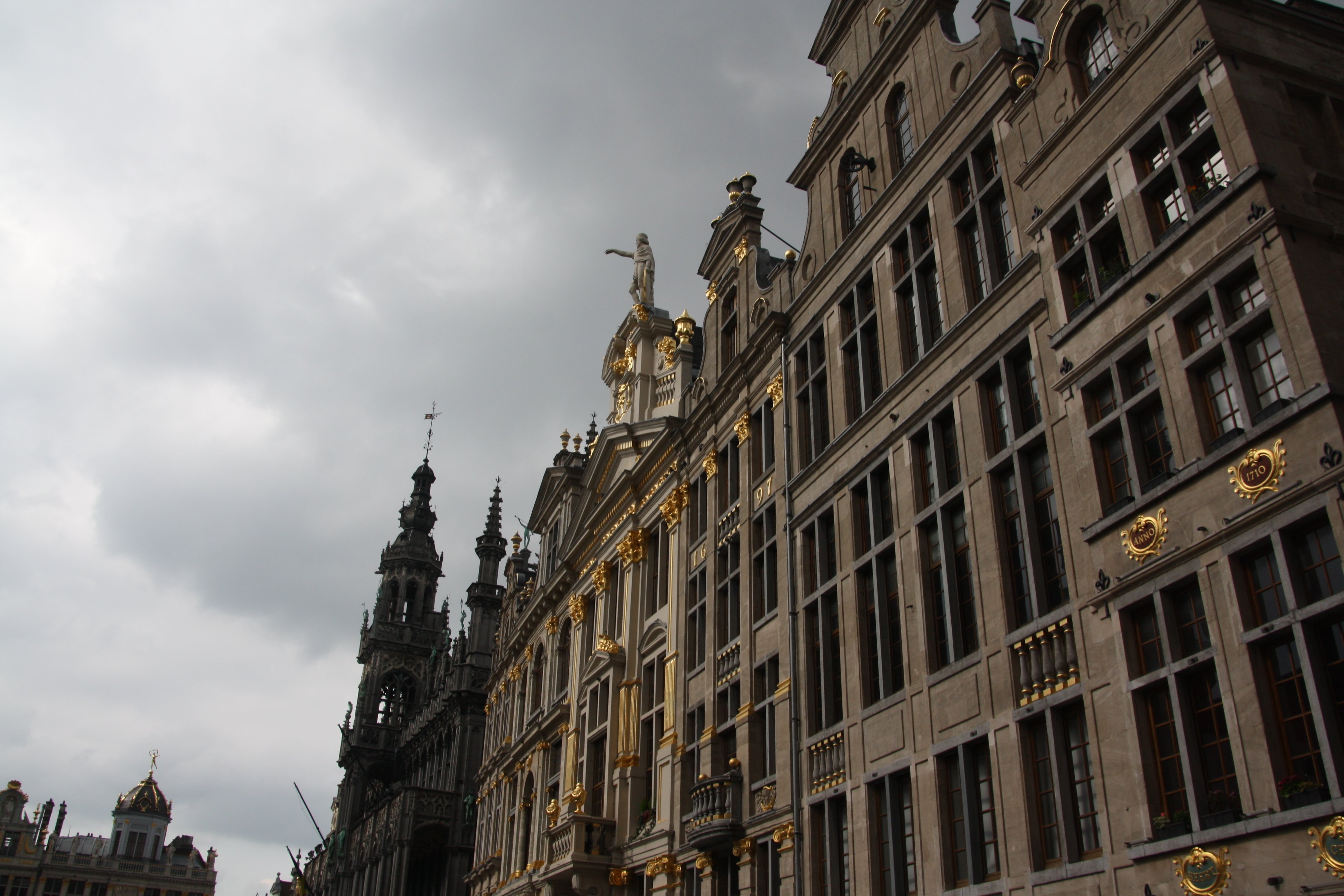 Building at the Grand Place with golden ornamentation on the outside.
