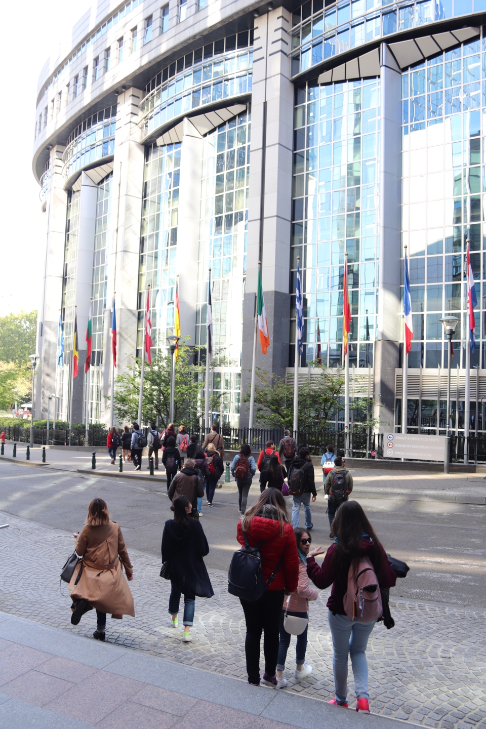 Students walking towards the EU Parliament building